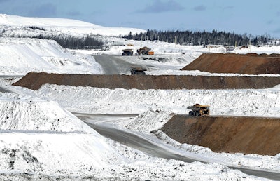 In this photo taken Feb. 9, 2016, the Hull-Rust Mahoning Mine, is seen from the overlook in Hibbing, Minn. The working mine is run by Hibbing Taconite Co. Several nearby mining operations have shut down amid the global slump in the steel industry. (AP Photo/Jim Mone)
