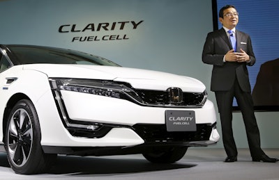 Honda Motor Co. President and Chief Executive Takahiro Hachigo speaks during a press conference in the media preview of the Clarity Fuel Cell at the automaker's headquarters in Tokyo, Thursday, March 10, 2016. Honda has rolled out a new fuel cell vehicle, the first of its kind to be a five-seater. The zero-emissions Clarity may not sell in big numbers, however, given its price tag of 7.66 million yen ($67,000). (AP Photo/Shizuo Kambayashi)