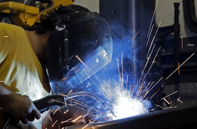 In this Monday, Sept. 14, 2015, photo, welder Gabriel Gonzalez welds a support beam at a local welding shop in Hialeah, Fla. On Wednesday, March 16, 2016, the Federal Reserve reports on industrial production for February. (AP Photo/Alan Diaz)
