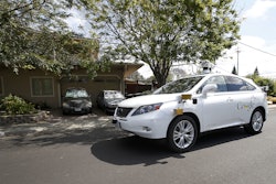 In this Wednesday, May 13, 2015, file photo, Google's self-driving Lexus car drives along street during a demonstration at Google campus on in Mountain View, Calif. As Google cars encounter more and more of the obstacles and conditions that befuddle human drivers, the autonomous vehicles are likely to cause more accidents, such as a recent low-speed collision with a bus. (AP Photo/Tony Avelar, File)