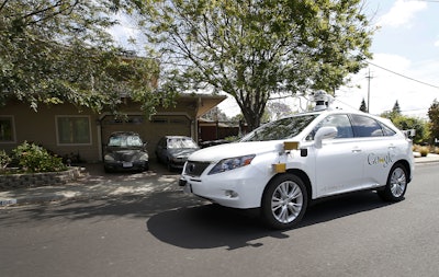 In this Wednesday, May 13, 2015, file photo, Google's self-driving Lexus car drives along street during a demonstration at Google campus on in Mountain View, Calif. As Google cars encounter more and more of the obstacles and conditions that befuddle human drivers, the autonomous vehicles are likely to cause more accidents, such as a recent low-speed collision with a bus. (AP Photo/Tony Avelar, File)