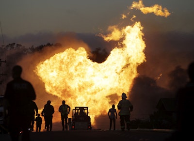 In this Sept. 9, 2010, file photo, a massive fire roars through a neighborhood in San Bruno, Calif. U.S. officials are moving to strengthen natural gas pipeline safety rules following decades of fiery accidents including the 2010 California explosion that killed 8 people and injured more than 50. (AP Photo/Paul Sakuma, File)