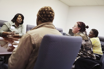 In this Thursday, March 3, 2016, photo, Sweet Tomatoes restaurant general manager Valerie Zimmerman, left, interviews Patricia Troutman, of Loganville, Ga., from right, Sabrina Britt, of Clarkston, Ga., and Nino Alexander, of Lithonia, Ga., for positions during a recruiting event at the Georgia Department of Labor office in Atlanta. On Wednesday, March 30, 2016, payroll processor ADP reports on how many jobs U.S. private companies added during March. (AP Photo/David Goldman)