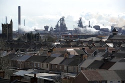 The Tata steel plant dominates the skyline over the roof tops of Port Talbot, Wales, Wednesday March 30, 2016. UK authorities say they will look at all viable options to keep the British steel industry at the heart of its manufacturing base after Tata Steel announced it may sell its UK assets. The sale could put thousands of jobs at risk. (Andrew Matthews/PA via AP)