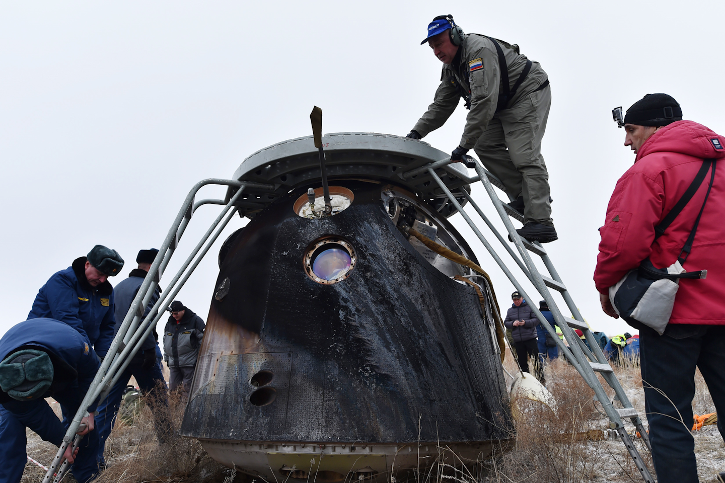 A search and rescue team works at the site of landing of the Soyuz TMA-18M space capsule carrying the International Space Station (ISS) crew of U.S. astronaut Scott Kelly and Russian cosmonauts Mikhail Kornienko and Sergey Volkov outside the town of Dzhezkazgan, Kazakhstan. (Krill Kudryavtsev/Pool Photo via AP)