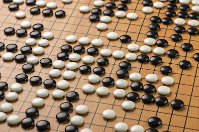 Stones on a Go board. (Image credit: Getty Images via GE Reports)