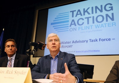 Michigan Gov. Rick Snyder addresses questions by the media after release of the Flint Water Advisory Task Force final report at Mott Community College in Flint, Mich., on Wednesday, March 23, 2016. (Daniel Mears/Detroit News via AP)