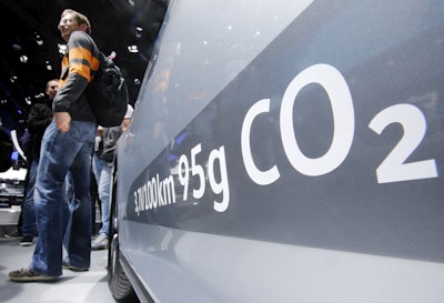 The amount of carbon dioxide emissions is written on a Volkswagen Passat Diesel at the Frankfurt Car Show in Frankfurt, Germany. (AP Photo/Michael Probst, File)