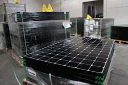 The latest generation of SunPower solar panels are stacked in Positive Energy Solar's warehouse in Albuquerque, N.M. (AP Photo/Susan Montoya Bryan)