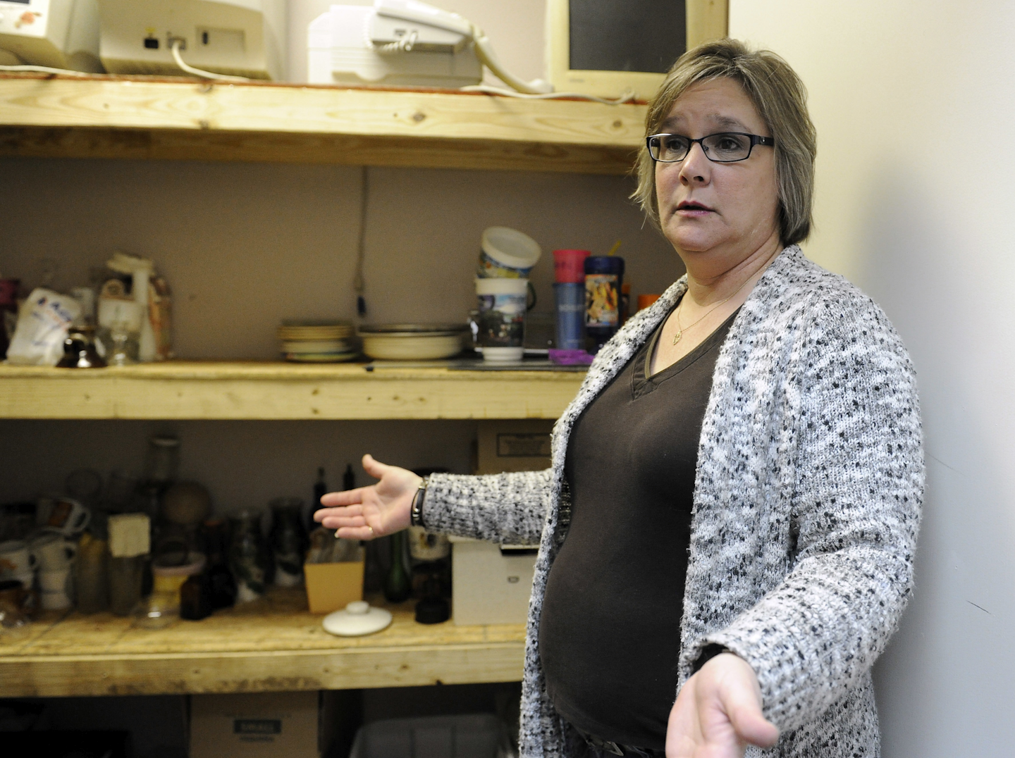 Shawn Baker talks about her new career in Houston. After Baker was laid off from a job building power units for offshore oil rigs she went into business for herself with an offbeat idea called Tantrums, a paid service that lets customers take out their frustrations by smashing plates, televisions and other objects in various rooms with sledgehammers, bats and pipes. (AP Photo/Pat Sullivan)