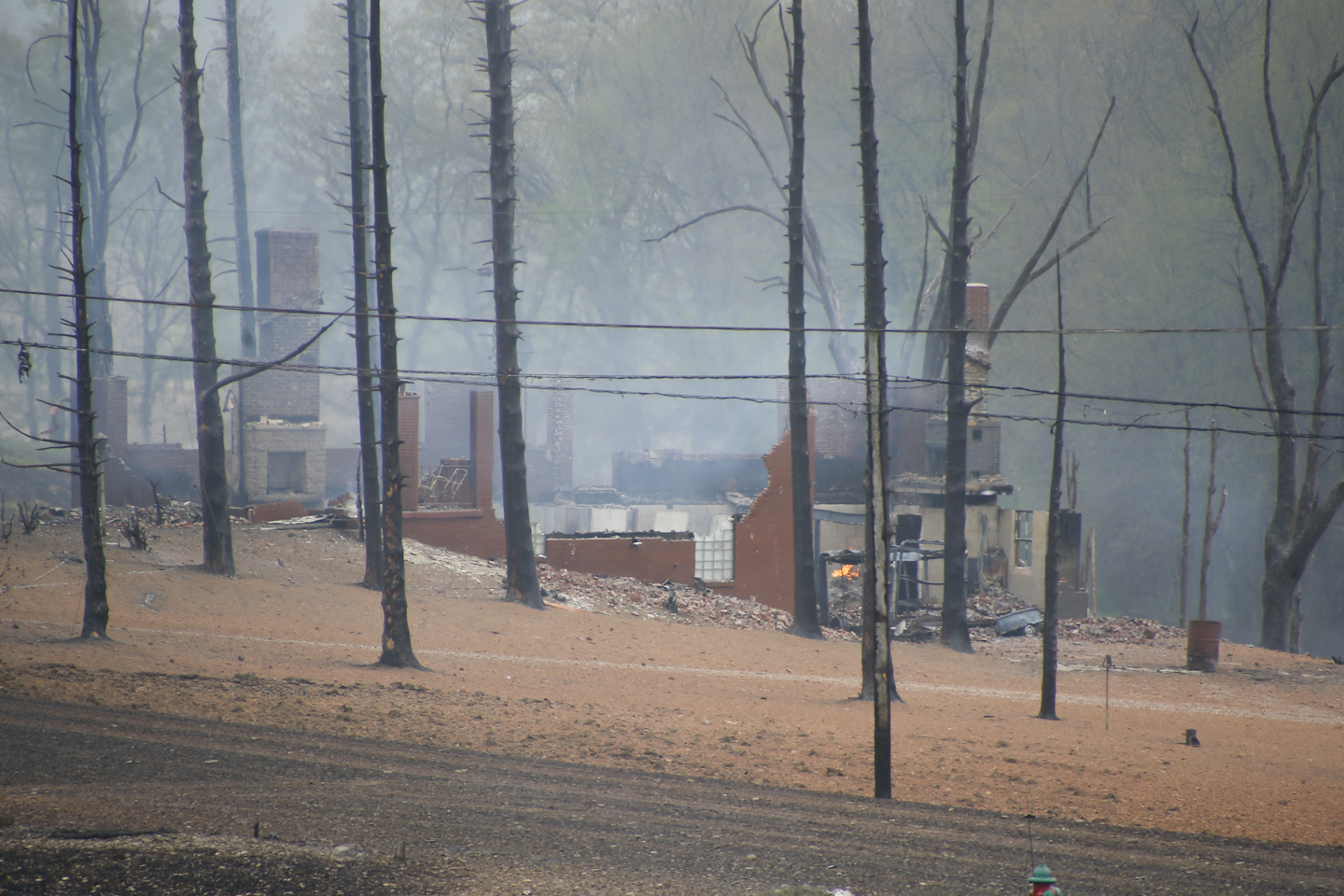 A burned out house is surrounded by charred ground and trees following a natural gas explosion Friday, April 29, 2016, in Salem Township, Pa. The explosion caused flames to shoot above nearby treetops in the largely rural area, about 30 miles east of Pittsburgh, and prompted authorities to evacuate businesses nearby. (AP Photo/Keith Srakocic)