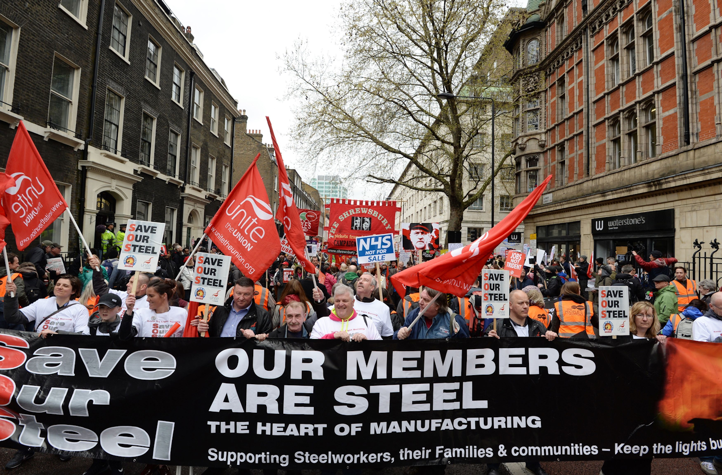 This Saturday, April 16, 2016, photo shows campaigners marching in an anti-austerity demonstration in central London. Tata Steel, a company based in India, announced plans to sell its U.K. businesses, which were losing 1 million pounds ($1.4 million) a day amid high costs and a glut of cheap Chinese steel in global markets. That raised fears the plant would close if Tata couldn’t find a buyer, eliminating 4,000 jobs and severing the economic lifeline of the town of Port Talbot. (Stefan Rousseau/PA via AP)