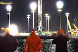 People watch as SpaceX Falcon 9 booster returns to Port Canaveral, Fla., early Tuesday, April 12, 2016. (Craig Rubadoux/Florida Today via AP)