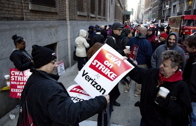 Verizon workers picket in front of a company facility, Wednesday, April 13, 2016, in New York. Tens of thousands of Verizon landline and cable workers on the East Coast walked off the job Wednesday morning after little progress in negotiations since their contract expired nearly eight months ago. (AP Photo/Mark Lennihan)