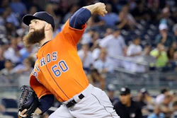 Houston Astros pitcher Dallas Keuchel throws against the New York Yankees in an August 2015 game against the New York Yankees. Major league pitchers will now be able to track the stress placed on their arms during pitching using wearable technology during games. (Image credit: Arturo Pardavila III)
