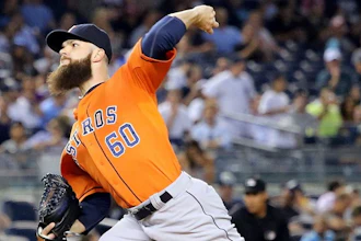 Houston Astros pitcher Dallas Keuchel throws against the New York Yankees in an August 2015 game against the New York Yankees. Major league pitchers will now be able to track the stress placed on their arms during pitching using wearable technology during games. (Image credit: Arturo Pardavila III)