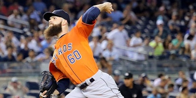 Houston Astros pitcher Dallas Keuchel throws against the New York Yankees in an August 2015 game against the New York Yankees. Major league pitchers will now be able to track the stress placed on their arms during pitching using wearable technology during games. (Image credit: Arturo Pardavila III)
