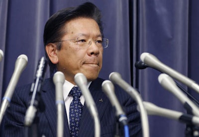 itsubishi Motors President Tetsuro Aikawa bites his lips during a press conference in Tokyo, Wednesday, April 20, 2016. (AP Photo/Shizuo Kambayashi)