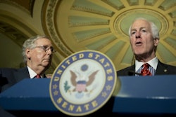 Senate Majority Leader Mitch McConnell listens at left as Senate Majority Whip John Cornyn speaks to reporters on Capitol Hill in Washington. (AP Photo/Manuel Balce Ceneta)