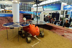 Visitors to the 16th China International Industry Fair (CIIF) look at a prototype of what a Chinese Mars rover would look like in Shanghai, China. (Chinatopix via AP)