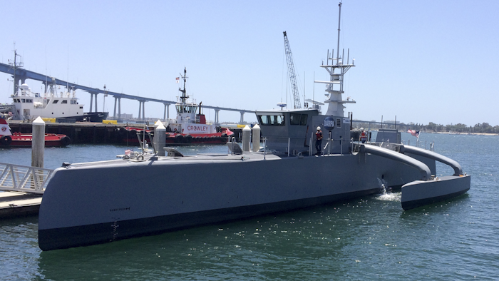 A self-driving, 132-foot military ship sits at a maritime terminal May 2 in San Diego. The Pentagon's research arm is launching tests on the world's largest unmanned surface vessel designed to travel thousands of miles out at sea without a single crew member on board. (AP Photo/Julie Watson)