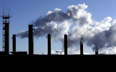 FILE - This Jan. 7, 2015, file photo, shows factory chimneys near O'Hare International Airport in Chicago. On Wednesday, May 4, 2016, the Commerce Department reports on U.S. factory orders for March. (AP Photo/Nam Y. Huh, File)