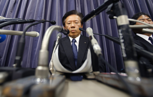 Mitsubishi Motors Corp. President Tetsuro Aikawa listens to a reporter's question during a press conference in Tokyo, Tuesday, April 26, 2016. Mitsubishi Motors, the Japanese automaker that acknowledged last month that it had intentionally lied about fuel economy data for some of its models, said an internal investigation found such tampering dated back to 1991. (AP Photo/Shizuo Kambayashi)