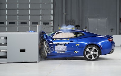 This March 24, 2016, photo provided by the Insurance Institute for Highway Safety shows a 2016 Chevrolet Camaro during a crash test at the IIHS Vehicle Research Center in Ruckersville, Va. The Ford Mustang, Chevrolet Camaro and Dodge Challenger didn’t get the highest ratings in new tests by the IIHS. (Insurance Institute for Highway Safety via AP)