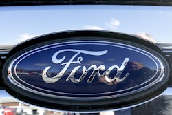 This Thursday, Nov. 19, 2015, file photo shows the blue Ford oval badge in the grill of a pickup truck on the sales lot at Butler County Ford in Butler, Pa. Ford is recalling the top-selling vehicle in the U.S. to fix a fluid leak that can reduce braking power. The recall covers about 271,000 F-150 pickups in North America from the 2013 and 2014 model years that have 3.5-liter V6 engines. (AP Photo/Keith Srakocic, File)