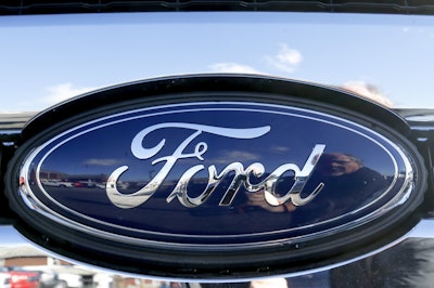 This Thursday, Nov. 19, 2015, file photo shows the blue Ford oval badge in the grill of a pickup truck on the sales lot at Butler County Ford in Butler, Pa. Ford is recalling the top-selling vehicle in the U.S. to fix a fluid leak that can reduce braking power. The recall covers about 271,000 F-150 pickups in North America from the 2013 and 2014 model years that have 3.5-liter V6 engines. (AP Photo/Keith Srakocic, File)