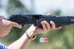 Jonathan Mossberg, whose iGun Technology Corp. is working to develop a 'smart gun,' demonstrates the firearm, in Daytona Beach, Fla. (AP Photo/Lisa Marie Pane)