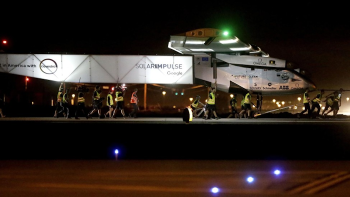 The plane left early Monday from California for a 16-hour trip to Phoenix to resume its journey around the world using only energy from the sun. (AP Photo/Matt York)