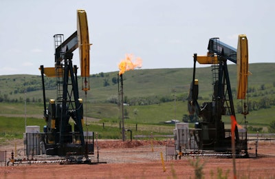 The Obama administration is finalizing a rule to cut methane emissions from U.S. oil and gas production by nearly half over the next decade. It’s part of an ongoing push by the president to curb climate change. (AP Photo/Charles Rex Arbogast, File)