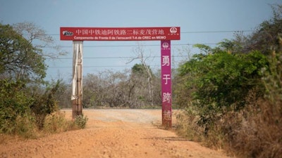 The red arched sign in Chinese and Spanish is all that remains of what was a bustling complex of 800 workers. (AP Photo/Ariana Cubillos)
