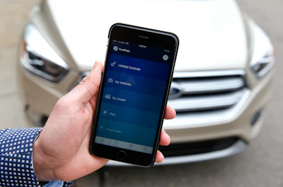 Automakers are reinventing themselves as 'mobility' companies that can accommodate all the different ways people get around. Ford created a technology-focused division based in Silicon Valley that will invest in promising transportation startups. It also launched FordPass, a smartphone app that helps users find parking or share their cars. (AP Photo/Paul Sancya)
