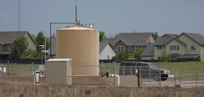 Photo Details Save Email Print History Photo |Caption|Summary Showing 3 of 11 previous : more Copyright 2016 The Associated Press. All rights reserved. This material may not be published, broadcast, rewritten or redistributed without permission. Caption In this May 27, 2016 photo, tanks sit near housing development off state highway 119 near Firestone, Colo. Colorado is imposing heftier fines on energy companies as it tries to resolve conflicts between growing cities and big oilfields at their doorstep. (AP Photo/David Zalubowski)