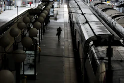 A man walks over an empty platform after a strike starts at the Gare du Nord train station, in Paris, Wednesday, June 1, 2016. Workers at the SNCF national rail authority, whose train service will be crucial to Euro 2016 spectators, are on an open-ended strike to protest their working conditions and a controversial government labor reform. (AP Photo/Markus Schreiber)