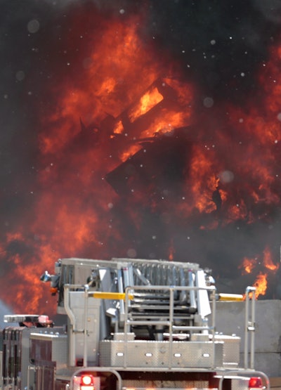 Firefighters respond following an explosion in a scrap pile at All Metals Recycling in Madison, Wis., Wednesday, June 1, 2016. The recycling plant is about 2 miles south of the state Capitol. (Michael P. King/Wisconsin State Journal via AP)