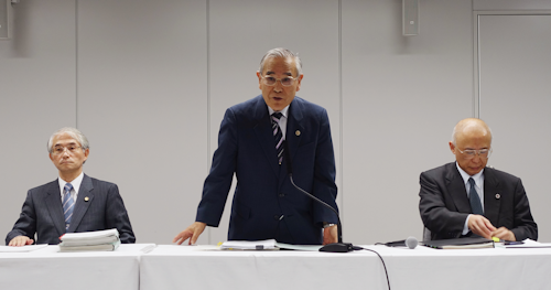Yasuhisa Tanaka, center, chairman of an outside investigation team appointed by the operator of Japan’s damaged Fukushima nuclear plant, speaks during a press conference in Tokyo Thursday, June 16, 2016. (AP Photo/Mari Yamaguchi)