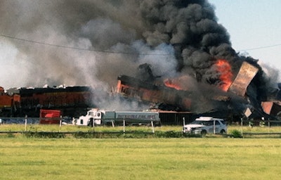 In this photo provided by Billy B. Brown, two freight trains are on fire Tuesday, June 28, 2016, after they collided and derailed near Panhandle, Texas. Texas Department of Public Safety Lt. Bryan Witt says the accident occurred Tuesday morning near the town of Panhandle, about 25 miles northeast of Amarillo. No injuries have been reported. (Billy B. Brown via AP)