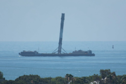 This June 2, 2016 photo made available by SpaceX shows the company's returned first-stage booster rocket on its ocean-landing platform, off the coast of Florida. The Falcon 9's legs were damaged during landing. (SpaceX via AP)