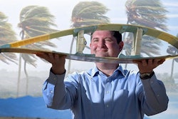 Todd Griffith displays a cross-section of a 50-meter blade. (Image courtesy of Randy Montoya, Sandia Labs)