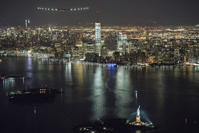 The solar-powered airplane on a globe-circling voyage that began more than a year ago in the United Arab Emirates reached a milestone Saturday, completing a trip across the United States with a Statue of Liberty fly-by before landing in New York. (Jean Revillard/ SI2 via AP)