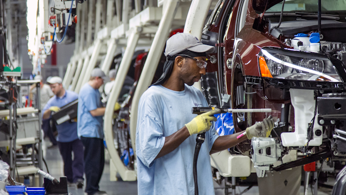 Employees at the Volkswagen plant in Chattanooga, Tenn., work on the assembly of a Passat sedans. (AP Photo/Erik Schelzig, File)