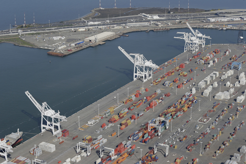 The former Oakland Army Base pier (at left) and the Port of Oakland (at lower right) in Oakland, Calif. (AP Photo/Eric Risberg, File)
