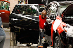 In this April 6, 2016, photograph, a technician works on a door assembly for a Nissan Altima on the line at the Nissan Canton Vehicle Assembly Plant in Canton, Miss. On Tuesday, July 5, 2016, the Commerce Department reports on U.S. factory orders for May. (AP Photo/Rogelio V. Solis)