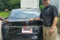 In this 2015 file photo provided by his neighbor, Krista Kitchen, Joshua Brown stands by his new Tesla electric car near his home in Canton, Ohio. Brown died in an accident in Florida on May 7, 2016 in the first fatality from a car using self-driving technology. According to statements by the government and the automaker, his vehicle's cameras didn't make a distinction between the white side of a turning tractor-trailer and the brightly lit sky while failing to automatically activate its brakes. The National Highway Traffic Safety Administration continues to investigate the crash. (Krista Kitchen via AP, File)