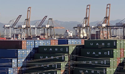 In this Feb. 12, 2015 file photo, the Port of Los Angeles, with some cargo loading cranes in the upright and idle position, are seen in this view from the San Pedro area of Los Angeles. Mayor Eric Garcetti has put together an advisory panel with the goal of reducing air pollution by deploying cleaner trucks, trains, ships and cargo-handling equipment, Wednesday, July 13, 2016. (AP Photo/Nick Ut, File)