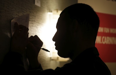 In this Tuesday, July 19, 2016, photo, a man fills out a job application at a job fair, in Miami Lakes, Fla. On Thursday, July 21, 2016, the Labor Department reports on the number of people who applied for unemployment benefits the week before. (AP Photo/Lynne Sladky)