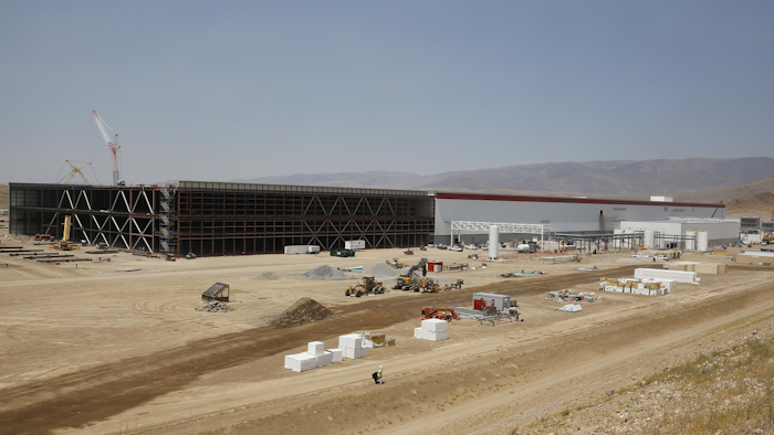 Construction continues on the new Tesla Gigafactory during a media tour Tuesday, July 26, 2016, in Sparks, Nev. It’s Tesla Motors’ biggest bet yet: A massive, $5 billion factory in the Nevada desert that could almost double the world’s production of lithium-ion batteries by 2018. (AP Photo/Rich Pedroncelli)
